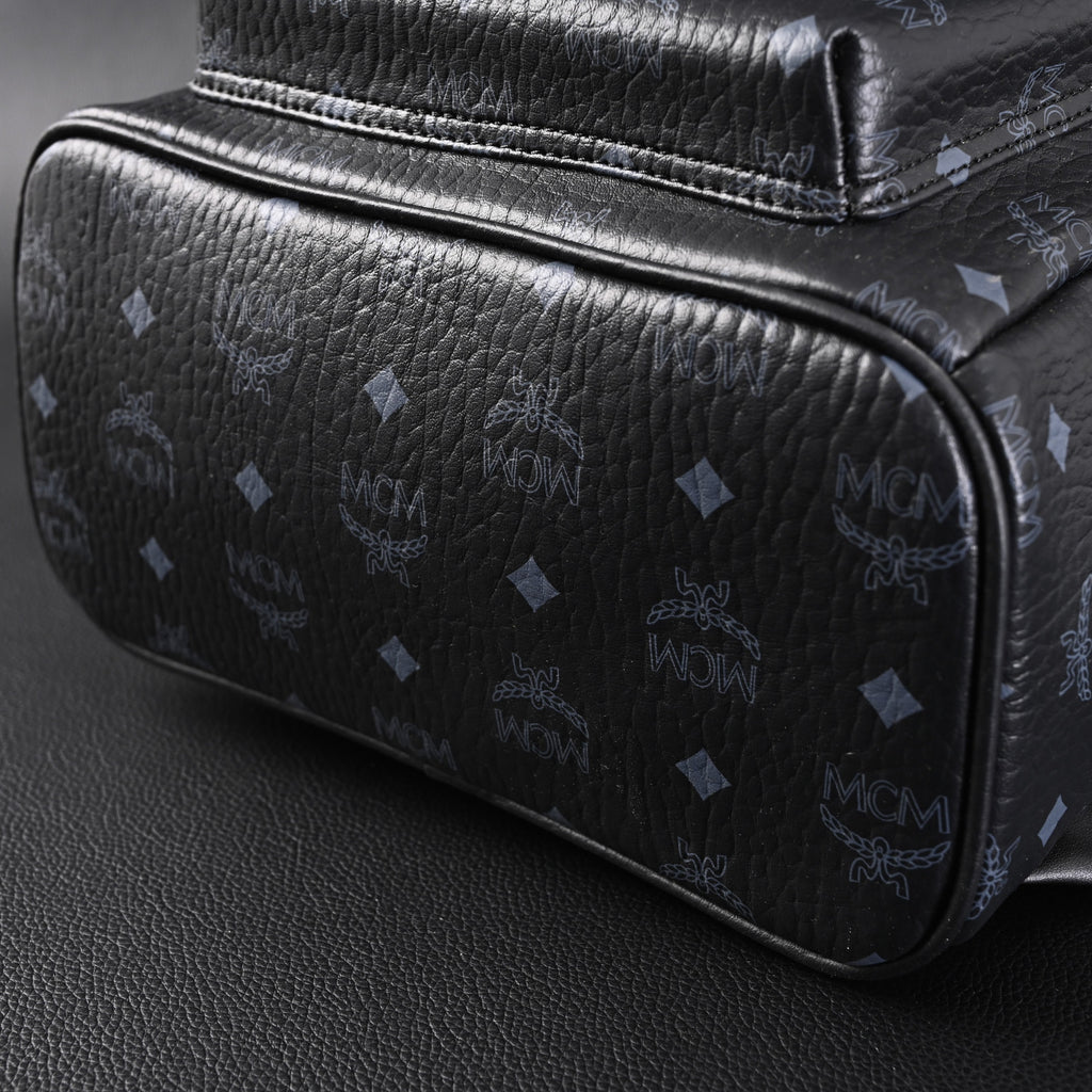 MCM Stark Visetos Medium Backpack – Black Monogram with Studded Detailing