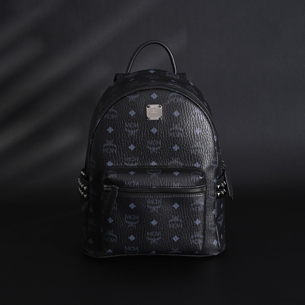 MCM Stark Visetos Medium Backpack – Black Monogram with Studded Detailing